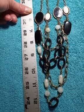 Gold-Tone Multi-Strand Necklace with Black and White Mother Of Pearl Look Beads